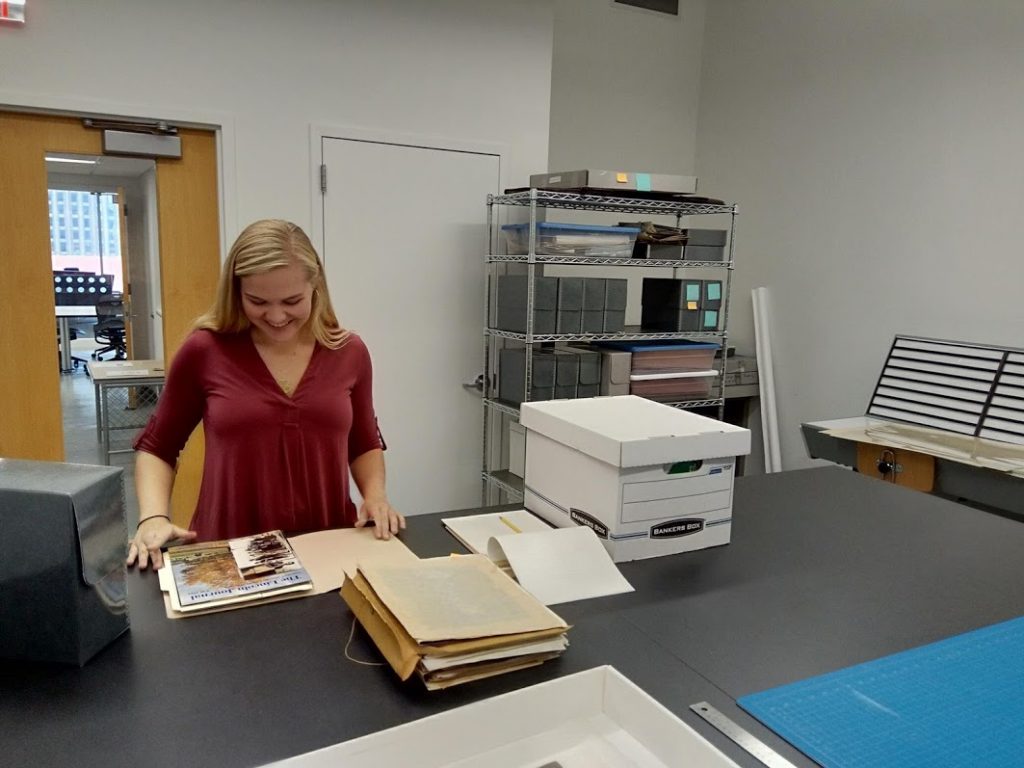 Kelin Baldrige, Project Archivist for the John Rhoden papers surveying the collection. 